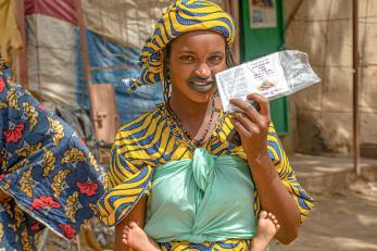 Malian displays voucher.
