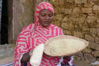 Malian woman making food.